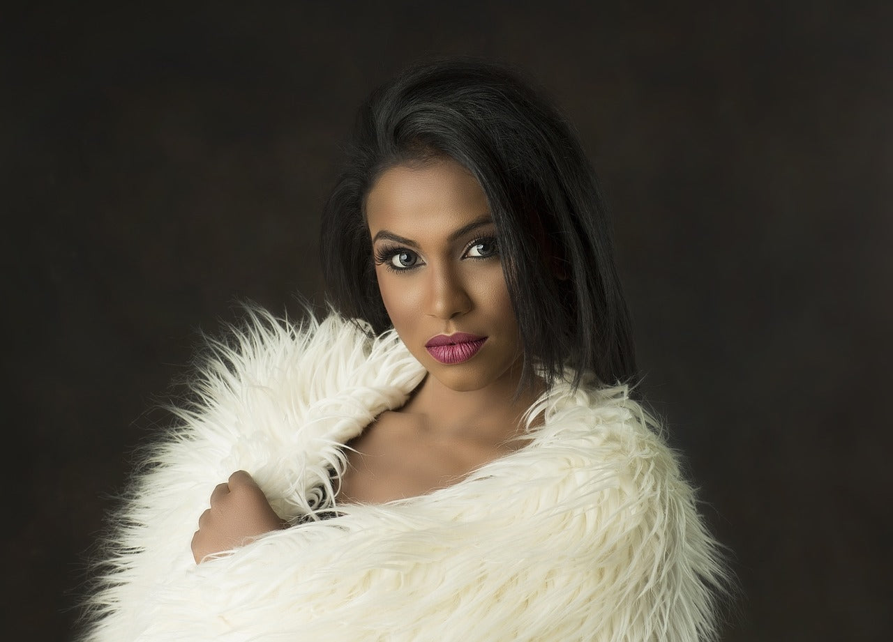 A woman wearing a white blanket